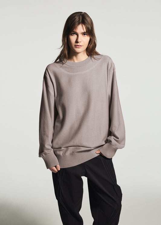 A model wears the A-POC ABLE ISSEY MIYAKE TYPE-K 010 top.