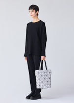 A model wears the Bao Bao Issey Miyake BLOCKY tote bag.