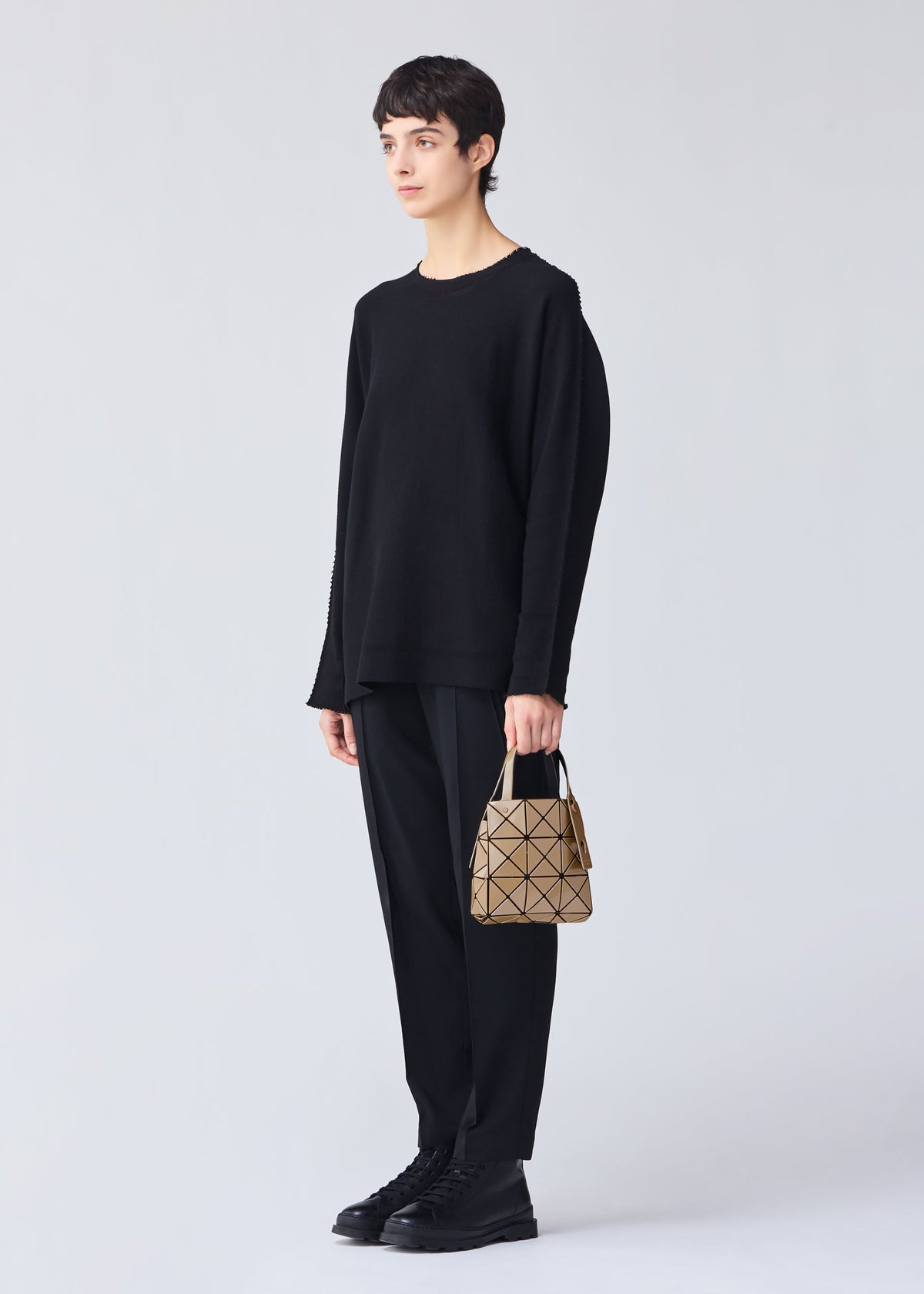 A model wears the Bao Bao Issey Miyake CARAT handbag.