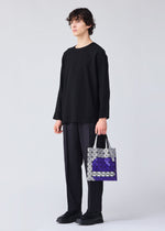 A model wears the Bao Bao Issey Miyake WONDER tote bag.