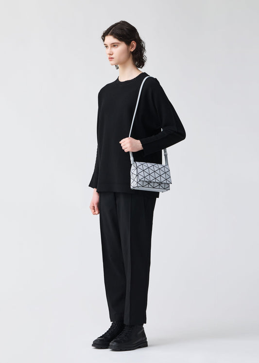 A model wears the BAOBAO ISSEY MIYAKE FOSSETTE shoulder bag(small).