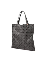 A detail shot of the BAO BAO ISSEY MIYAKE PRISM DENIM tote bag.
