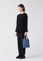 A model wears the BAO BAO ISSEY MIYAKE PRISM DENIM prism-denim-tote-bag7-7-blue.