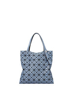 A product shot of the BAO BAO ISSEY MIYAKE PRISM DENIM tote bag in blue.