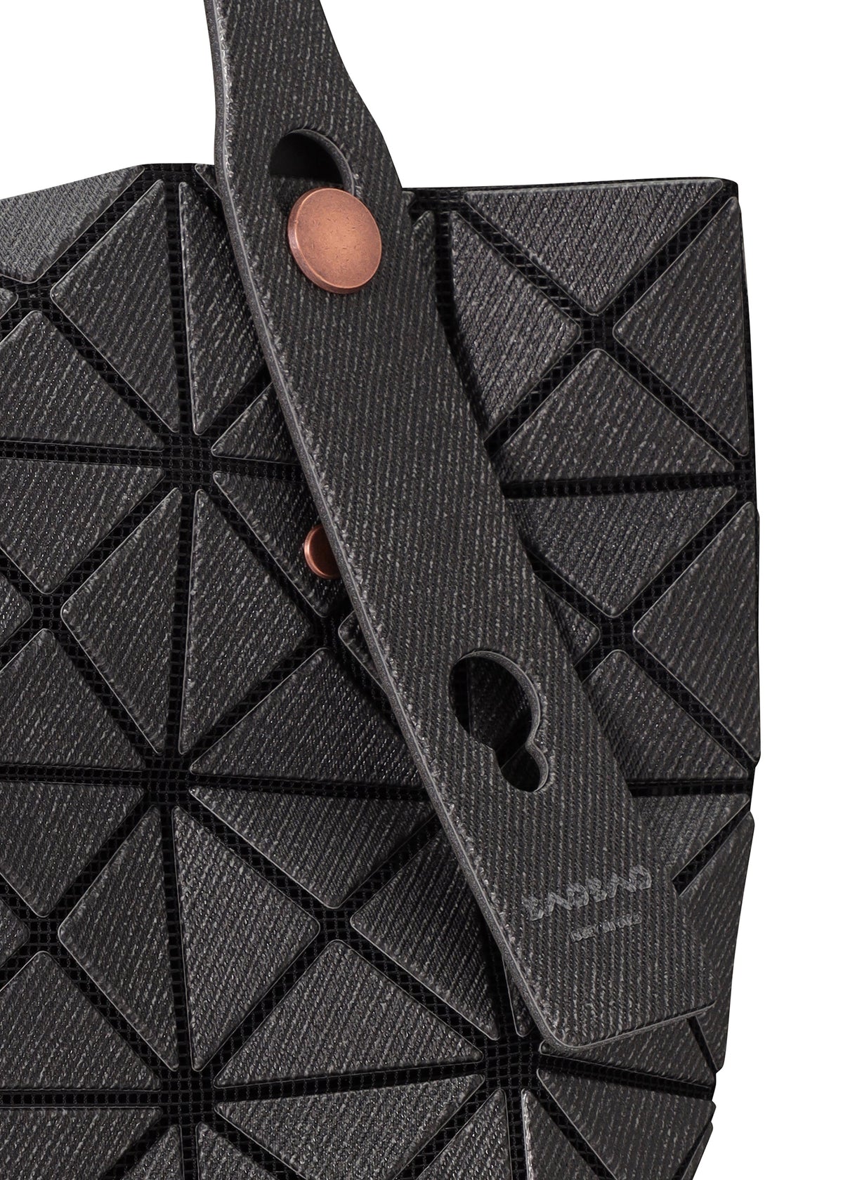 A detail shot of the BAO BAO ISSEY MIYAKE PRISM DENIM tote bag.