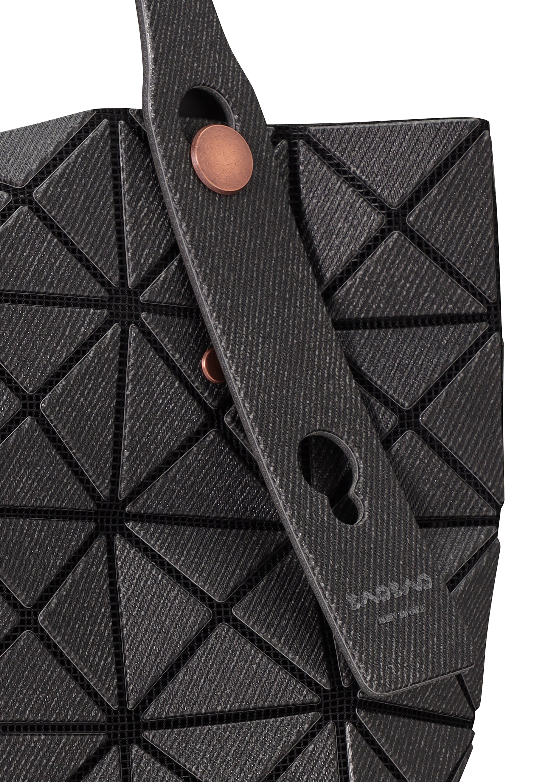 A detail shot of the BAO BAO ISSEY MIYAKE PRISM DENIM tote bag.