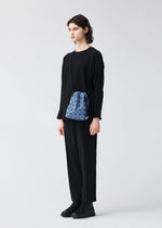 A model wears the BAO BAO ISSEY MIYAKE WRING DENIM wring-denim-shoulder-bagsmall-black.