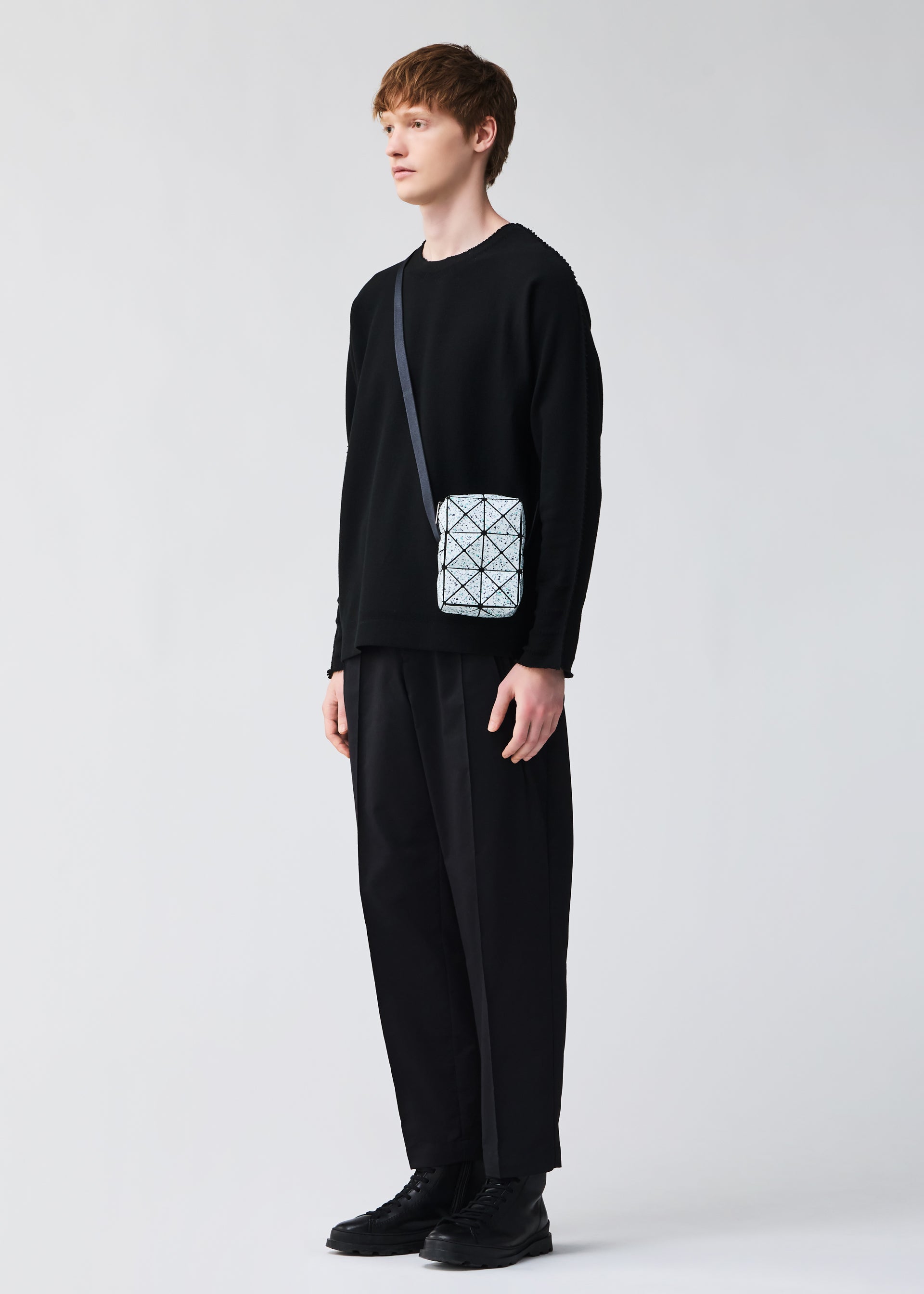 A model wears the BAOBAO ISSEY MIYAKE WEEKENDERM shoulder bag.