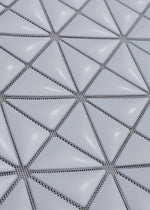 A detail shot of the BAO BAO ISSEY MIYAKE MINIATURE tote bag.
