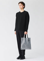 A model wears the BAO BAO ISSEY MIYAKE PRISM prism-tote-black-black-6.