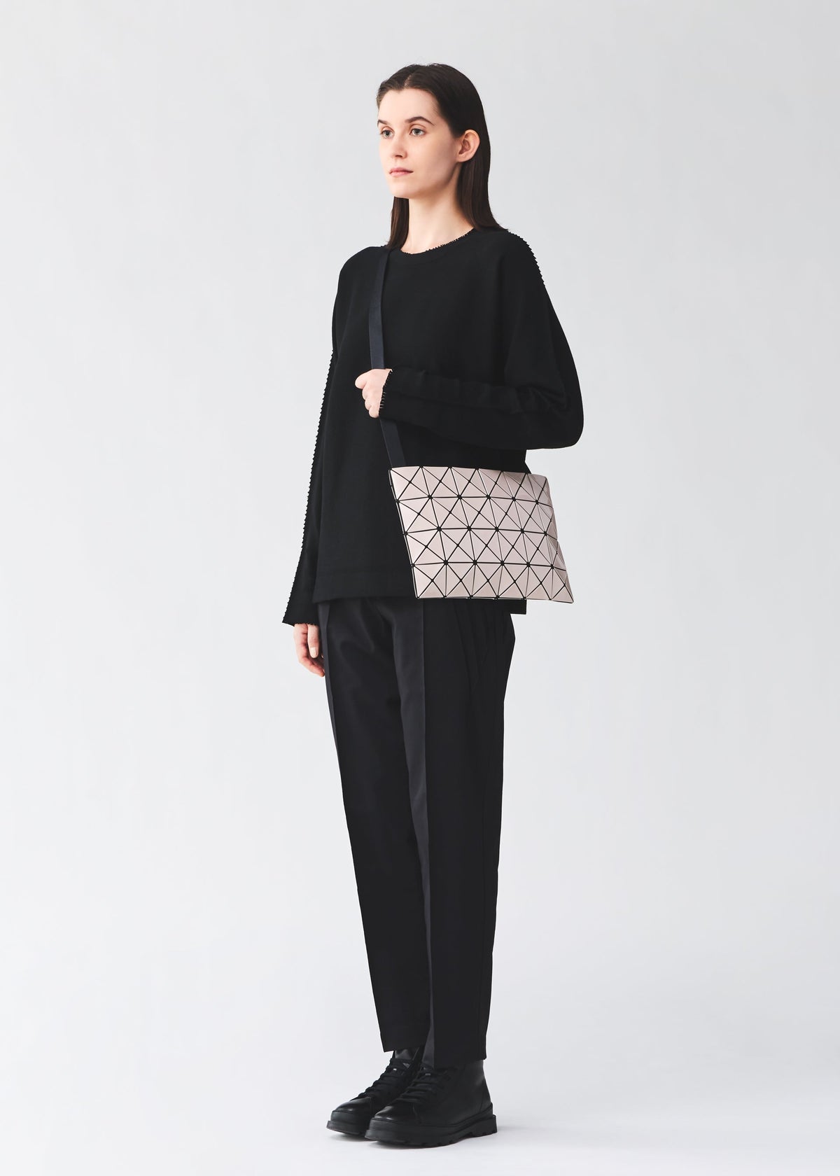 A model wears the BAO BAO ISSEY MIYAKE LUCENT lucent-basics-shoulder-bag4-6-white-1.