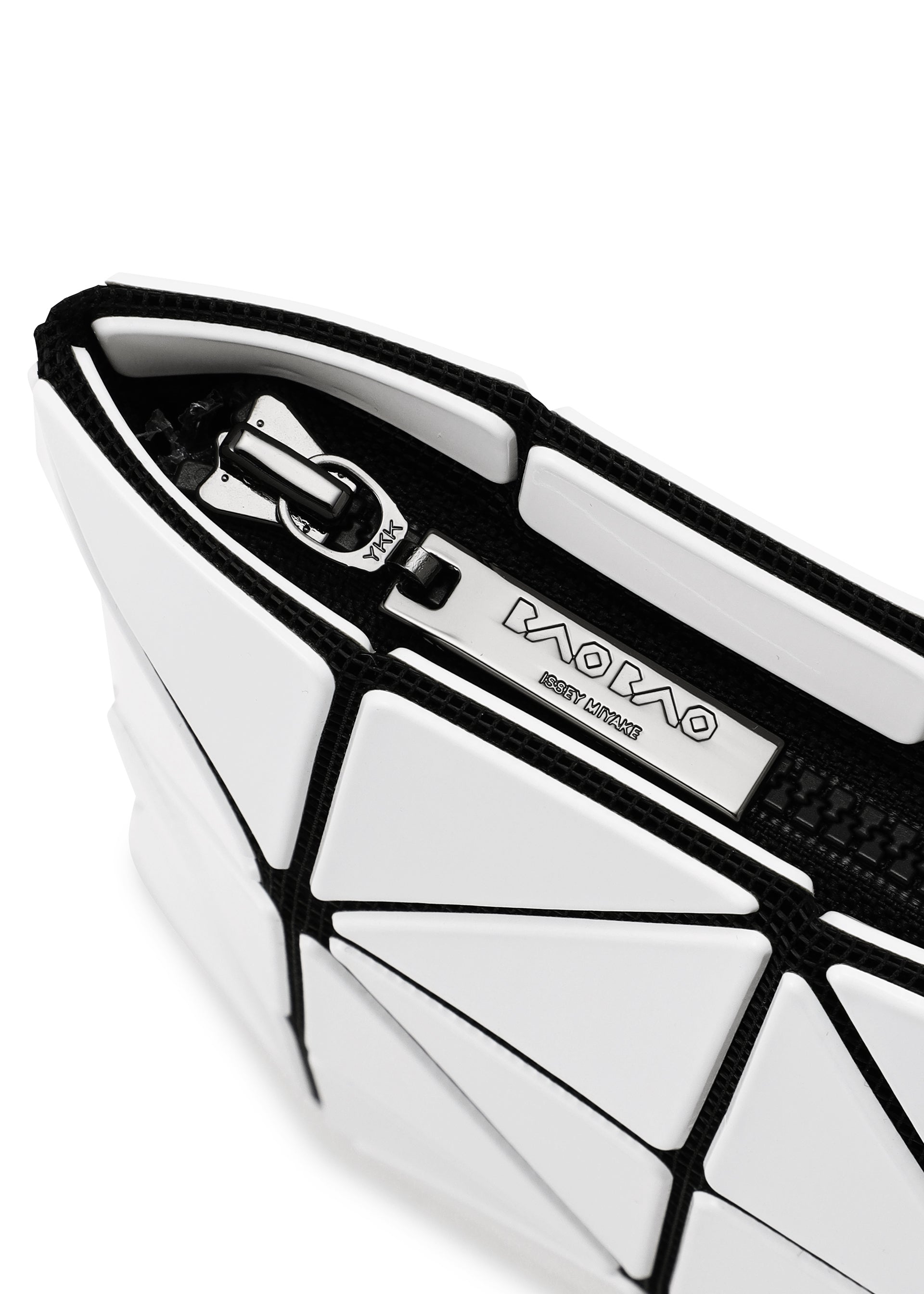 A detail shot of the BAO BAO ISSEY MIYAKE LUCENT pouch.