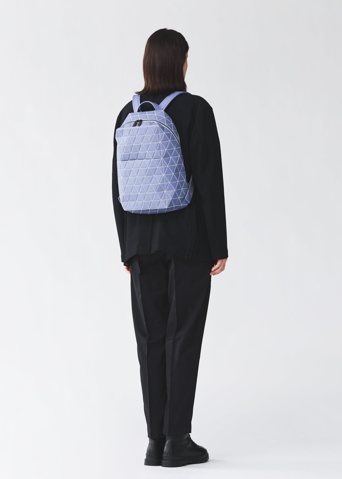 A model wears the BAO BAO ISSEY MIYAKE HEXAGON backpack.