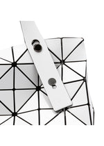 A detail shot of the BAO BAO ISSEY MIYAKE CARTON hand bag.