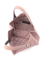 A detail shot of the BAO BAO ISSEY MIYAKE PRISM PLUS tote bag.
