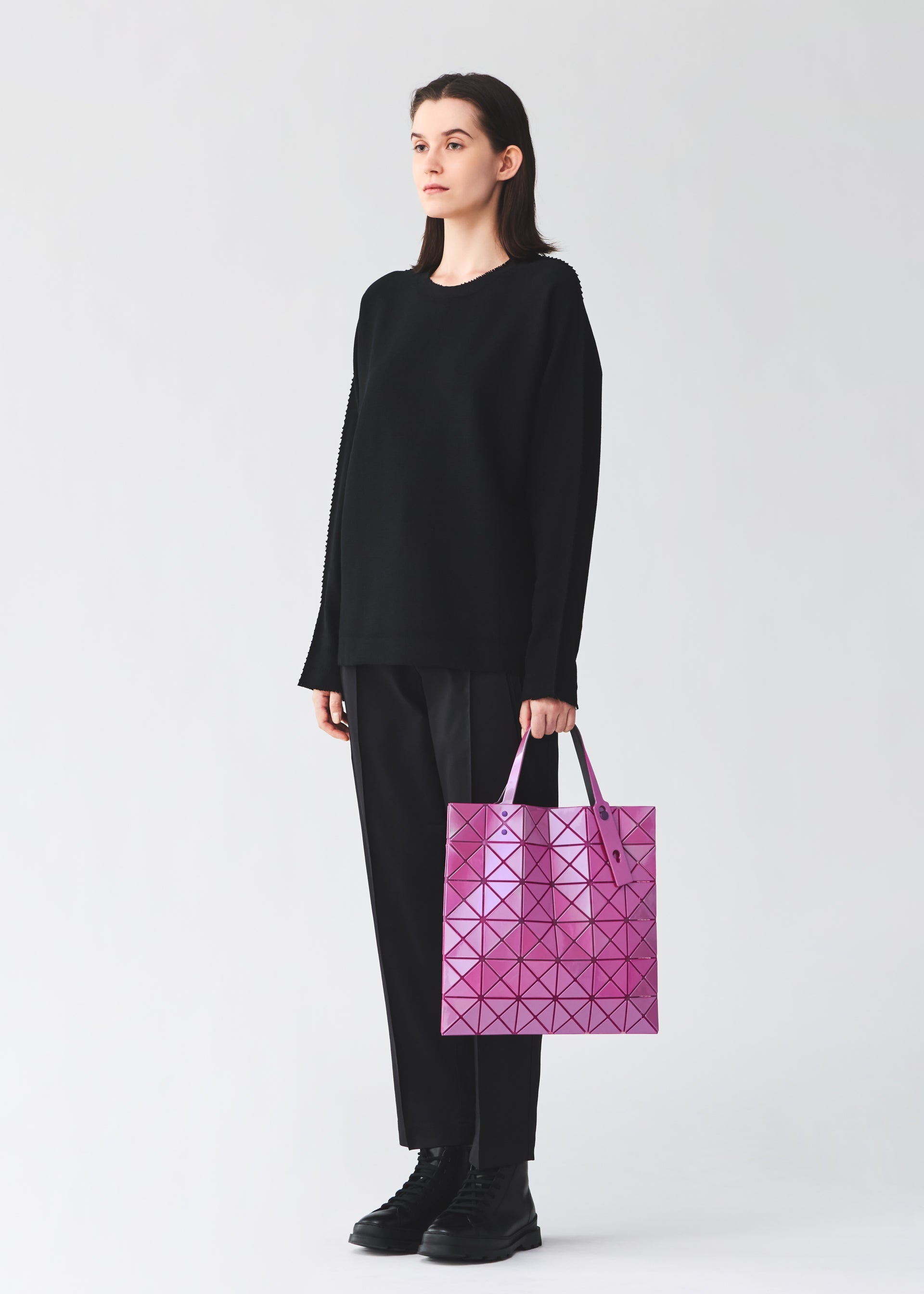 A model wears the BAO BAO ISSEY MIYAKE LUCENT ONE-TONE lucent-one-tone-tote-bag6-blue-grey-7.