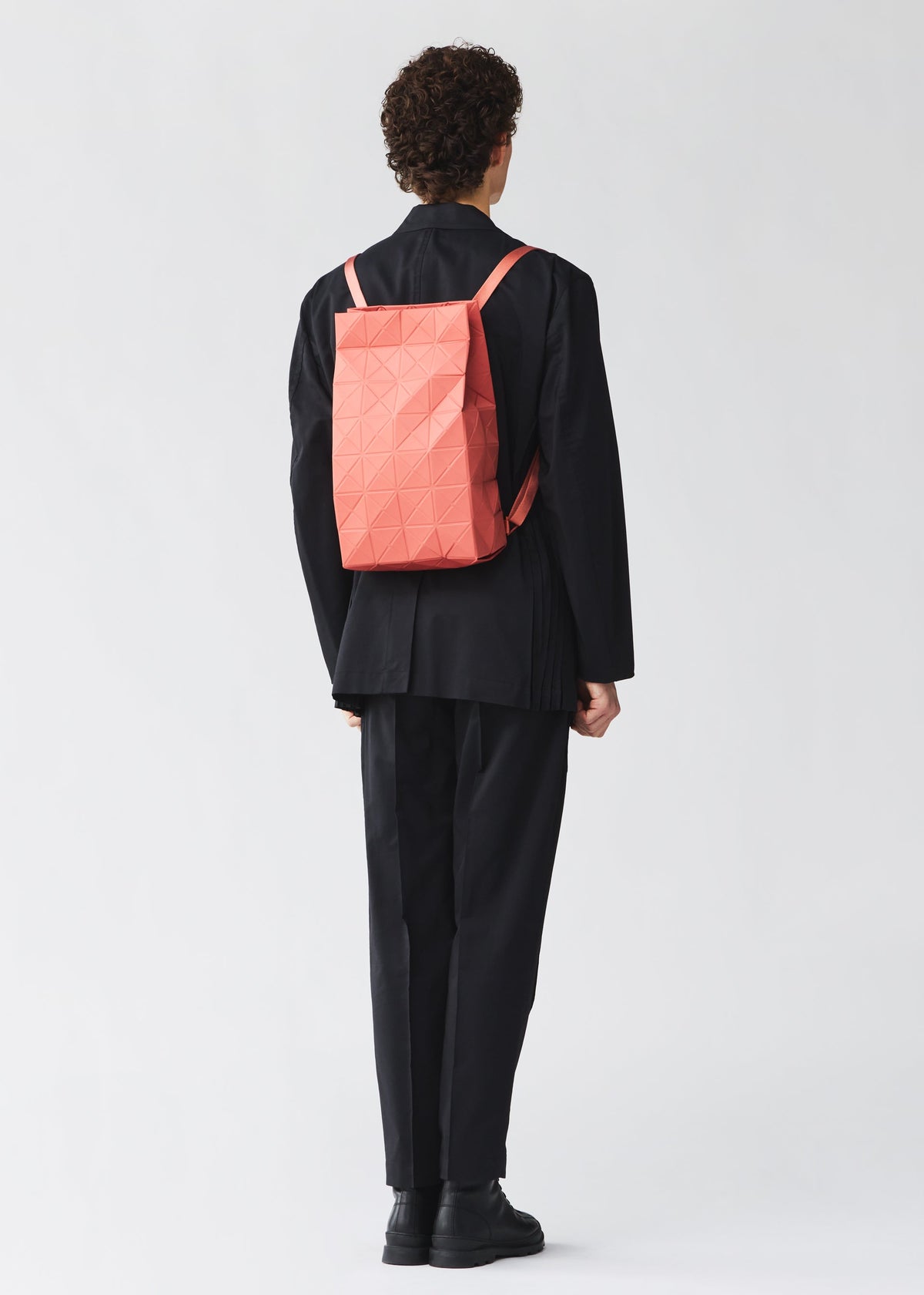 A model wears the BAO BAO ISSEY MIYAKE TRACK backpack.