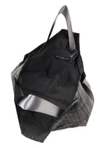 A detail shot of the BAO BAO ISSEY MIYAKE CART tote bag.