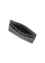 A detail shot of the BAO BAO ISSEY MIYAKE OYSTER card case.