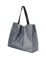 A detail shot of the BAO BAO ISSEY MIYAKE CART REFLECTOR tote bag.