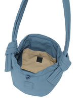 A detail shot of the Good Goods Issey Miyake FUWA FUWA bag.