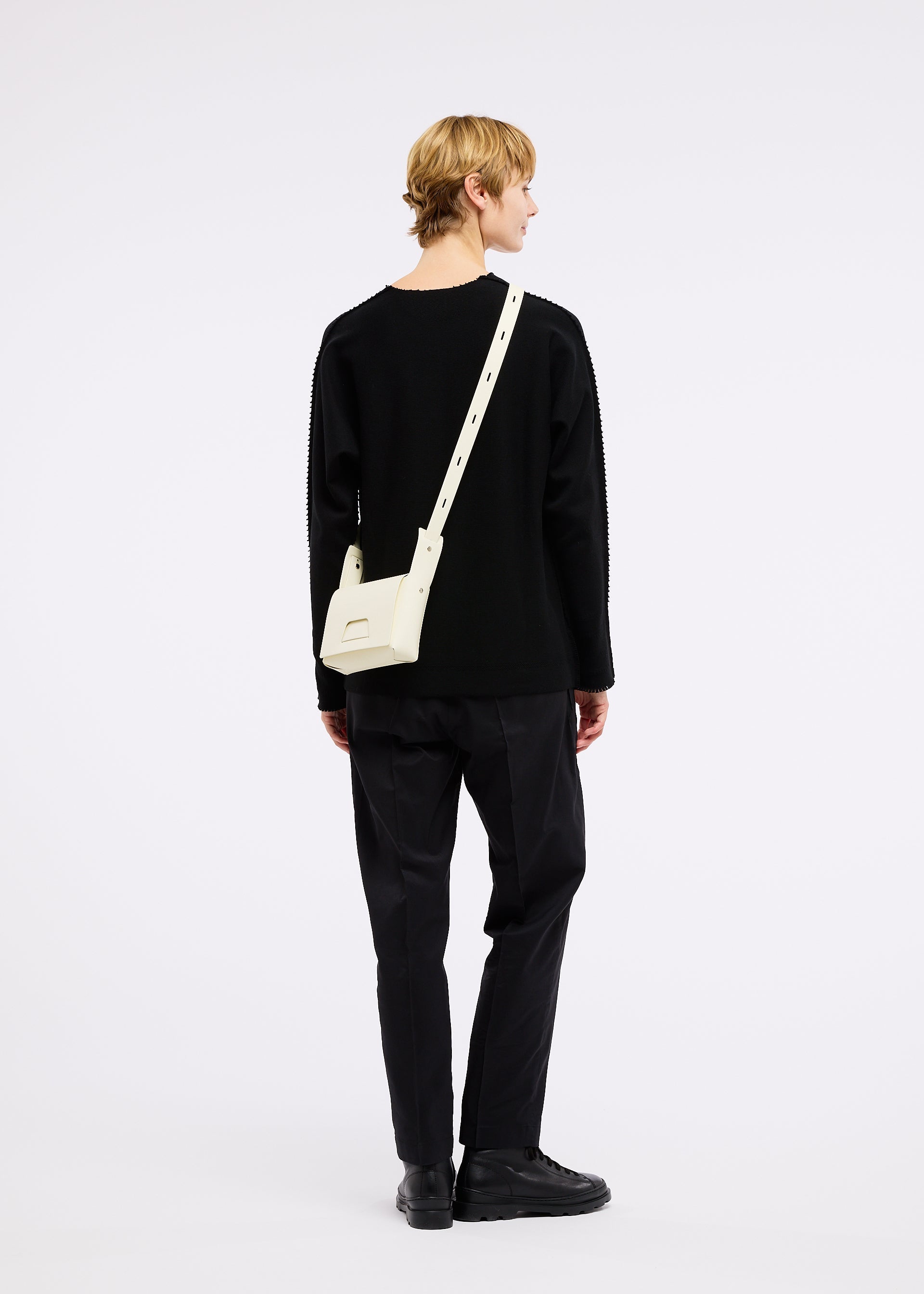 A model wears the GOOD GOODS ISSEY MIYAKE BOX bag.