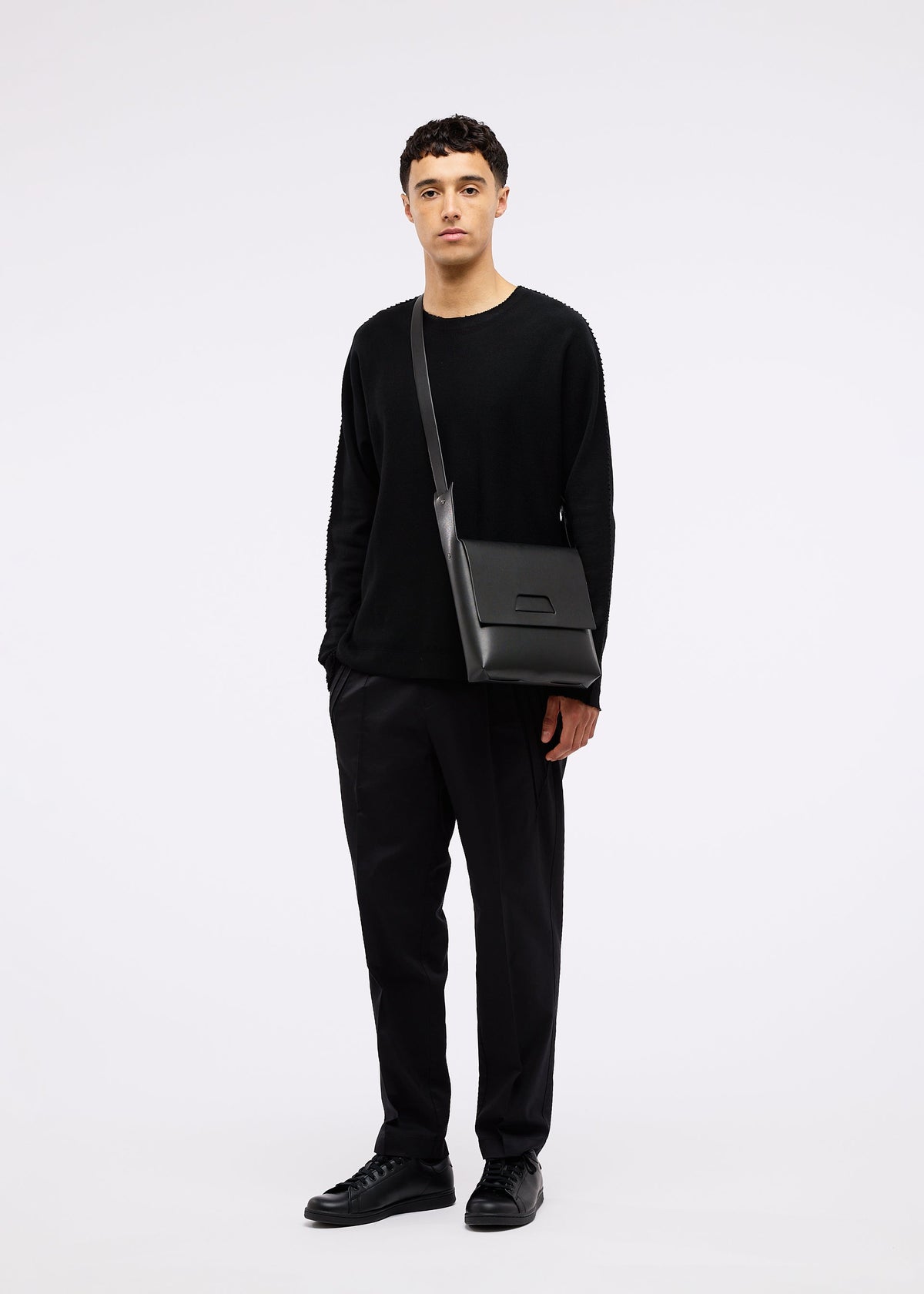 A model wears the GOOD GOODS ISSEY MIYAKE BOX bag.