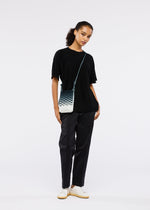 A model wears the GOOD GOODS ISSEY MIYAKE MOKKO NET GRADATION gg66ag37174os.