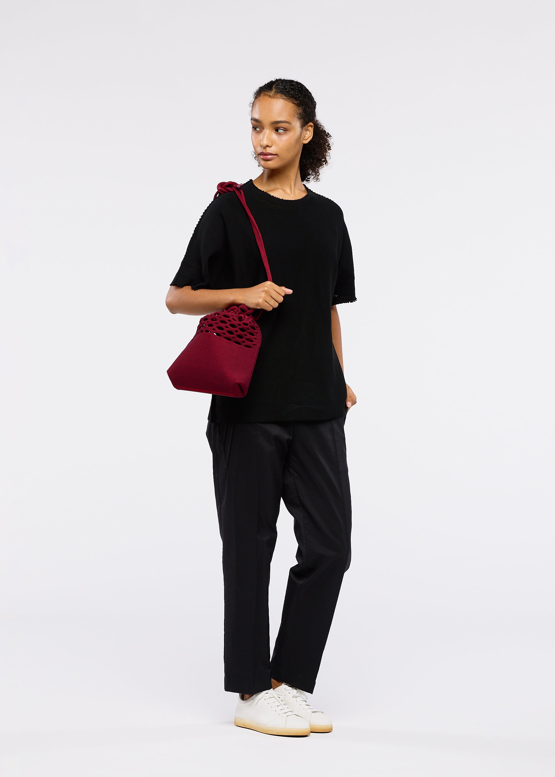 A model wears the Good Goods Issey Miyake MOKKO BASKET .