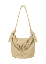 A product shot of the GOOD GOODS ISSEY MIYAKE FUWA FUWA  in beige.