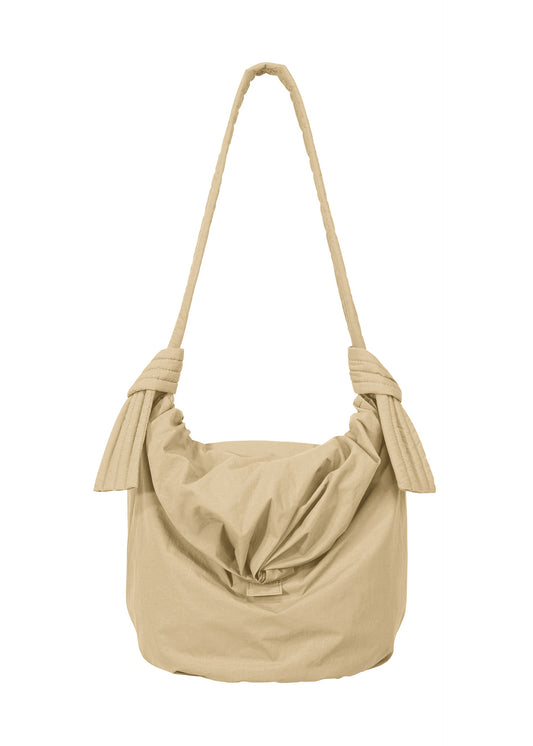 A product shot of the GOOD GOODS ISSEY MIYAKE FUWA FUWA  in beige.