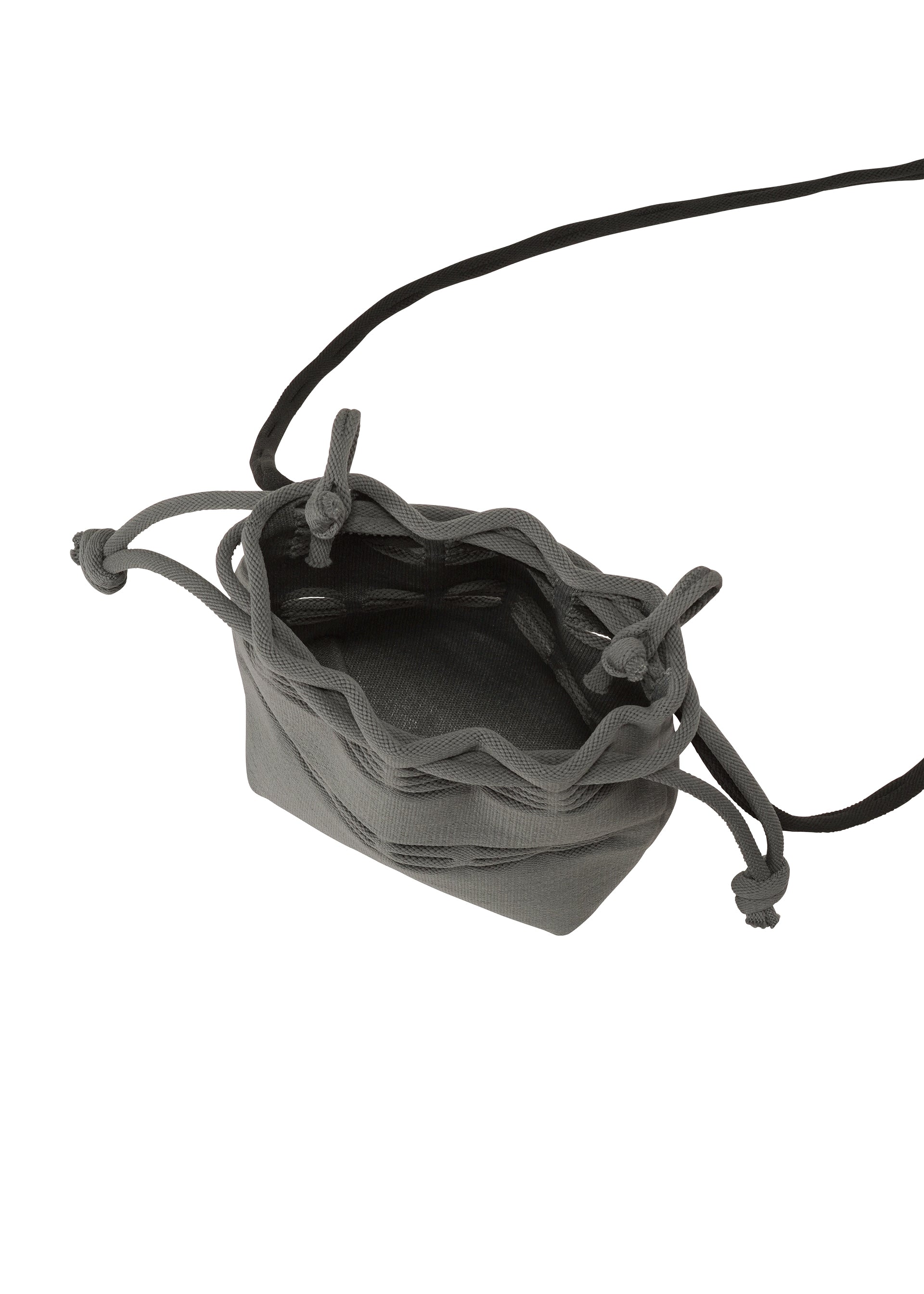 A detail shot of the GOOD GOODS ISSEY MIYAKE MOKKO POCKET BI-COLOR bag.