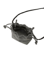 A detail shot of the GOOD GOODS ISSEY MIYAKE MOKKO POCKET BI-COLOR bag.