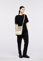 A model wears the GOOD GOODS ISSEY MIYAKE MOKKO WASHI mokko-washi.