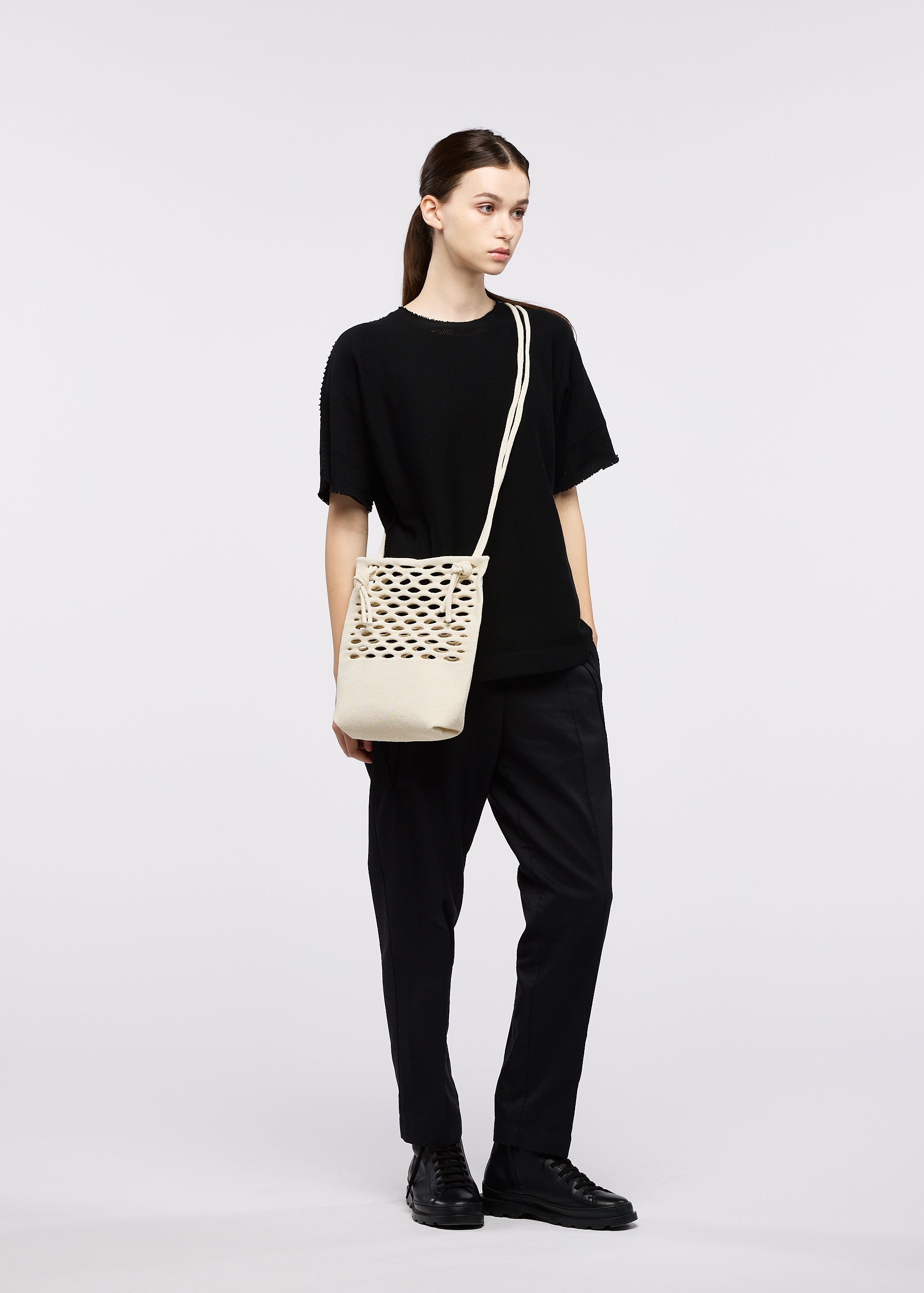 A model wears the GOOD GOODS ISSEY MIYAKE MOKKO WASHI mokko-washi.