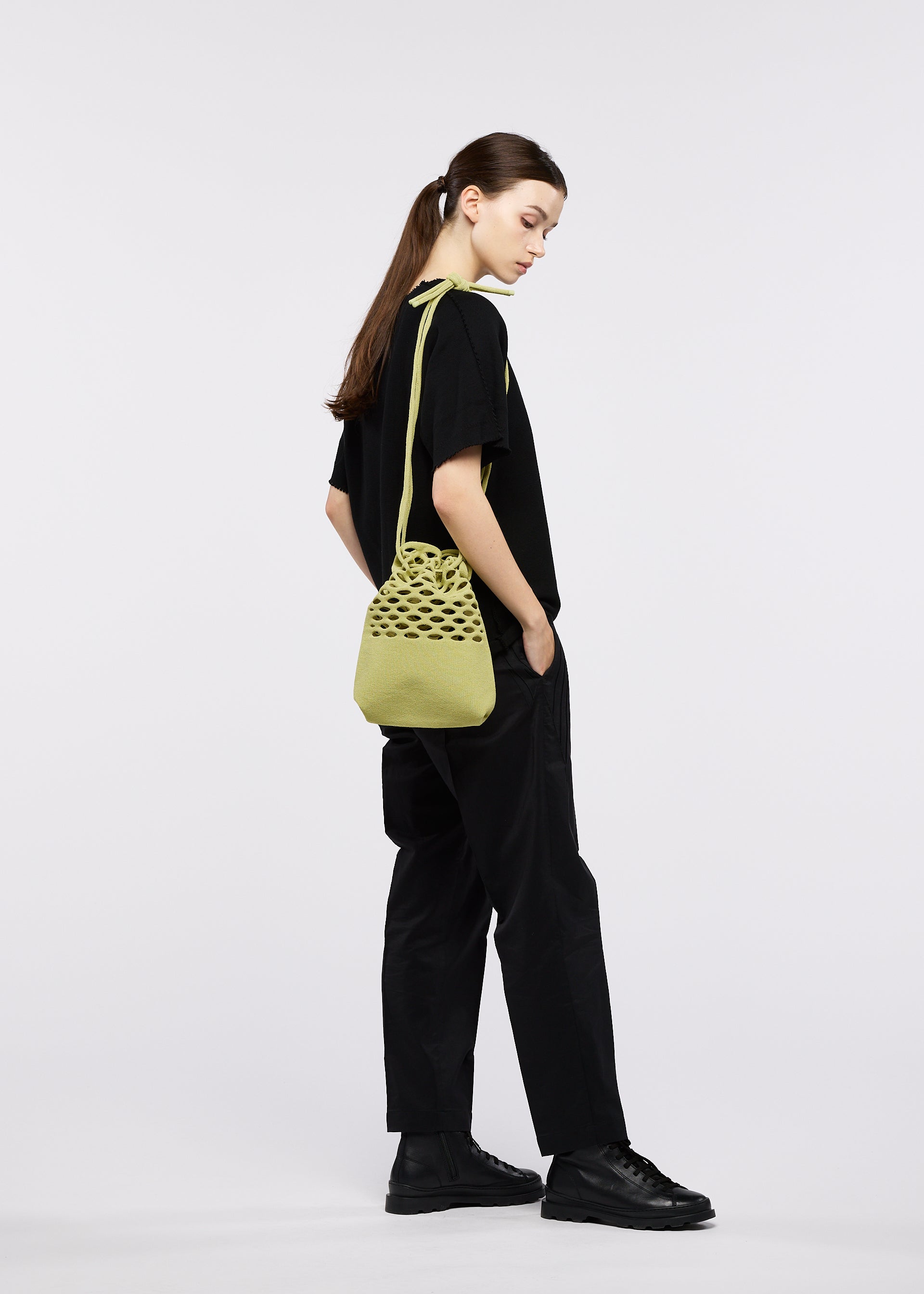 A model wears the GOOD GOODS ISSEY MIYAKE MOKKO WASHI mokko-washi.