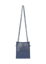 A detail shot of the GOOD GOODS ISSEY MIYAKE MOKKO WASHI bag.