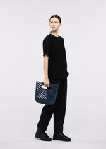A model wears the GOOD GOODS ISSEY MIYAKE MOKKO WASHI mokko-washi-1.
