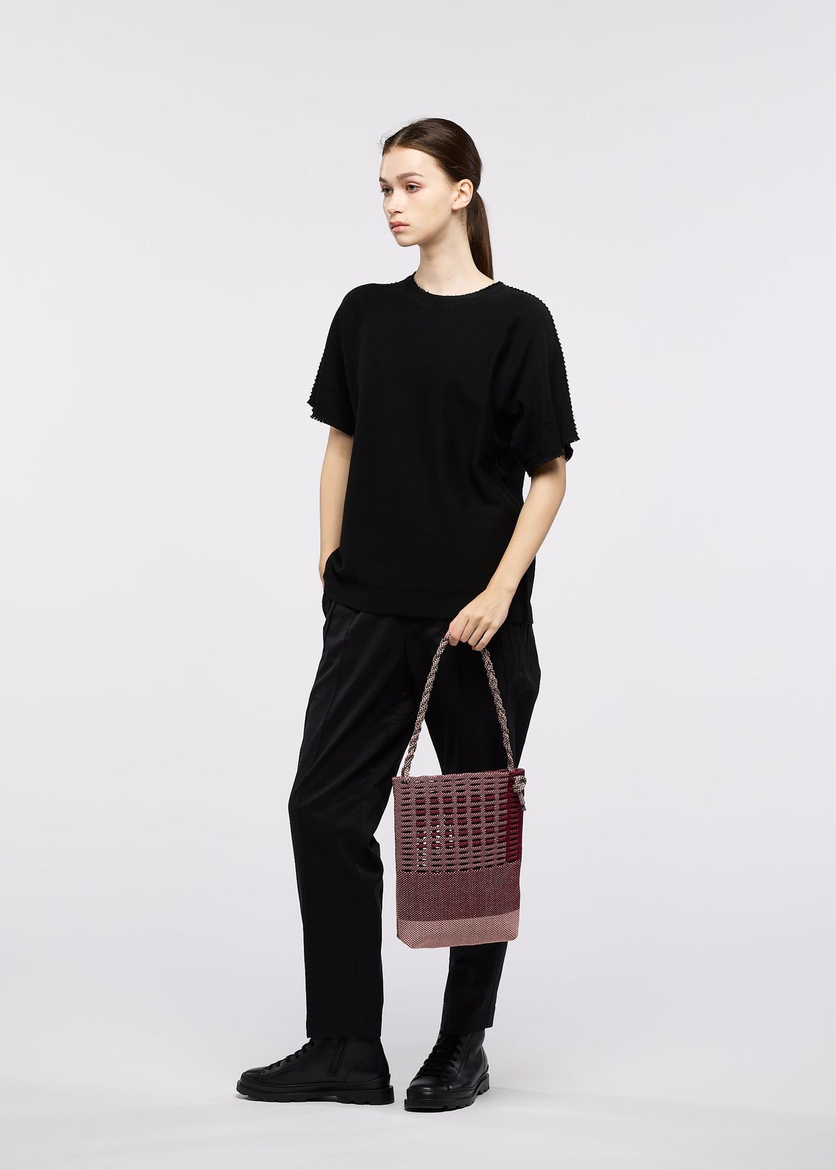 A model wears the GOOD GOODS ISSEY MIYAKE MOKKO KNOT mokko-knot-1.