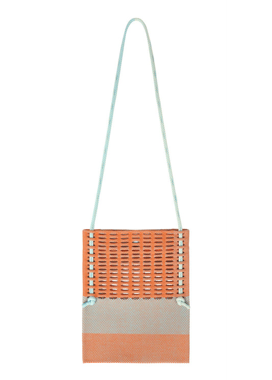 A product shot of the GOOD GOODS ISSEY MIYAKE MOKKO KNOT bag in warm orange mix.