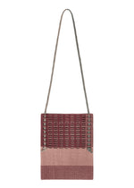 A product shot of the GOOD GOODS ISSEY MIYAKE MOKKO KNOT bag in burgundy mix.