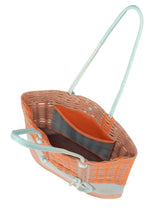 A detail shot of the GOOD GOODS ISSEY MIYAKE MOKKO KNOT bag.