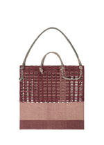 A detail shot of the GOOD GOODS ISSEY MIYAKE MOKKO KNOT bag.