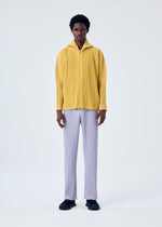 A model wears the HOMME PLISSÉ ISSEY MIYAKE MC JUNE trousers.