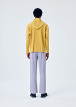 A model wears the HOMME PLISSÉ ISSEY MIYAKE MC JUNE trousers.