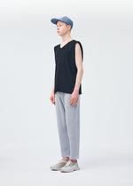 A model wears the HOMME PLISSÉ ISSEY MIYAKE PLEATS CAP hat.