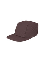 A product shot of the HOMME PLISSÉ ISSEY MIYAKE PLEATS CAP hat in dark purple (88).