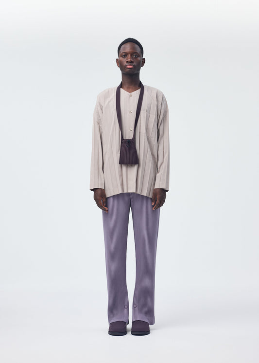 A model wears the HOMME PLISSÉ ISSEY MIYAKE POCKET bag.