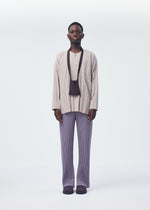 A model wears the HOMME PLISSÉ ISSEY MIYAKE POCKET bag.