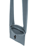 A detail shot of the HOMME PLISSÉ ISSEY MIYAKE POCKET bag.